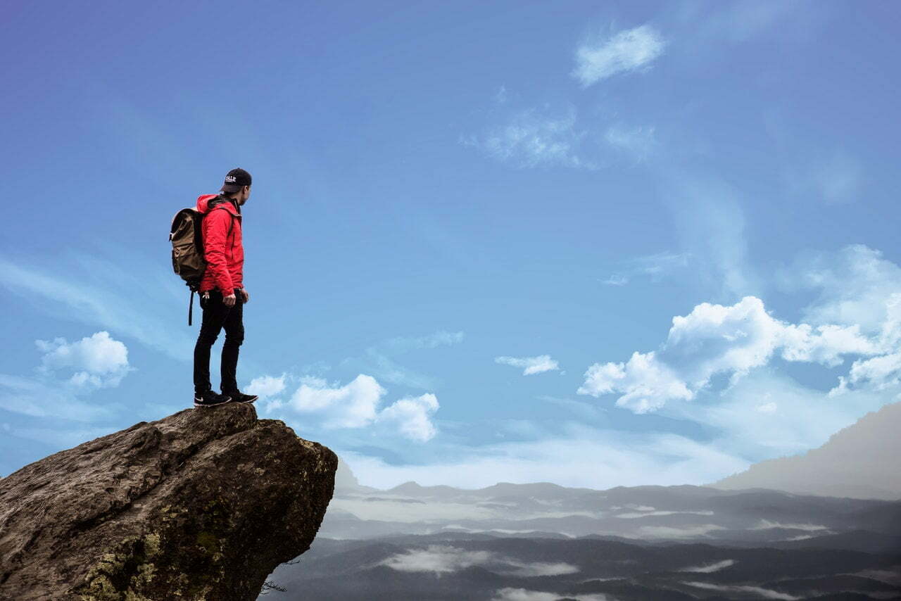 a person standing on a rock