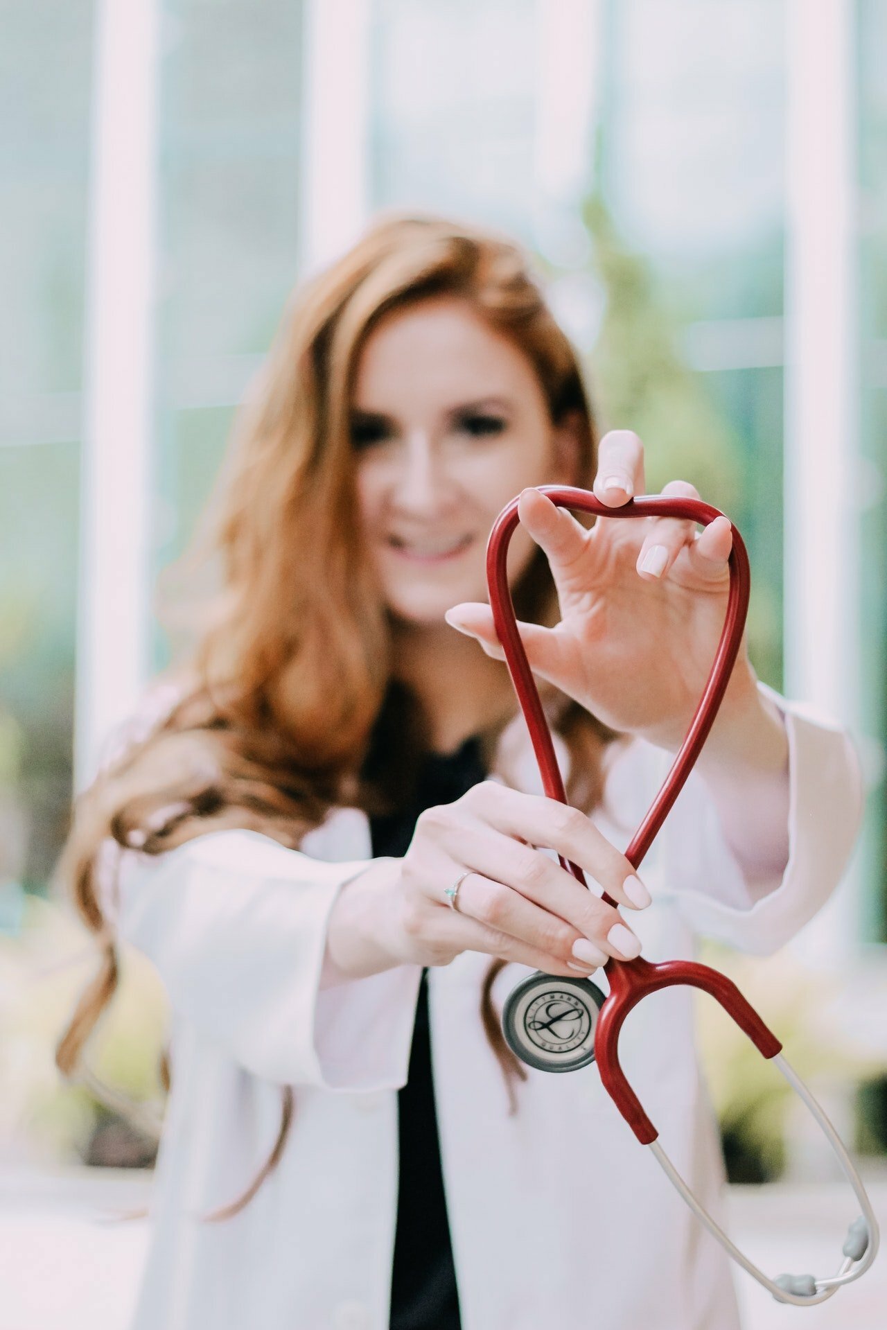 a doctor examining a woman's mouth