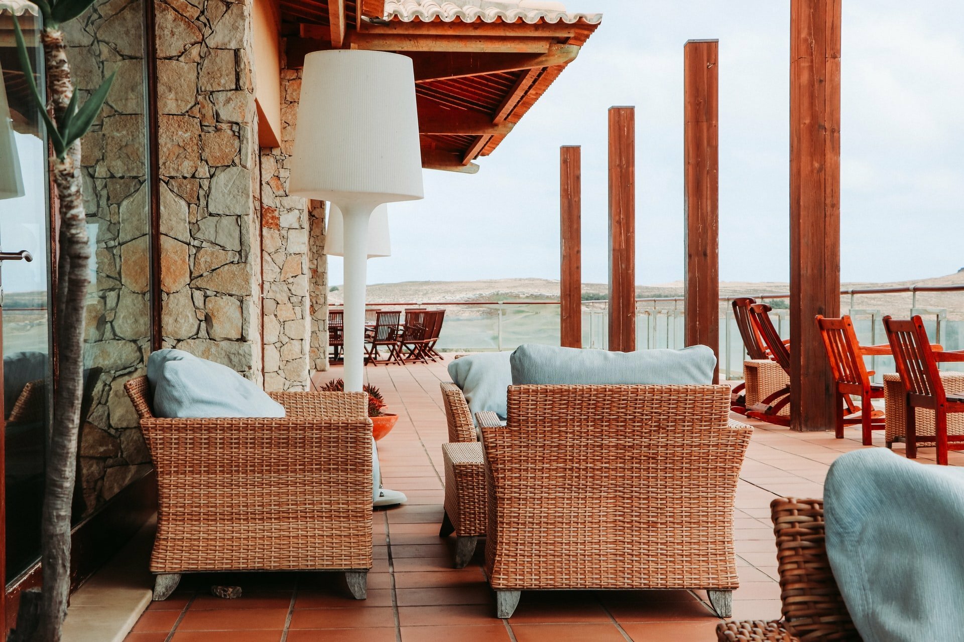 a patio with chairs and tables