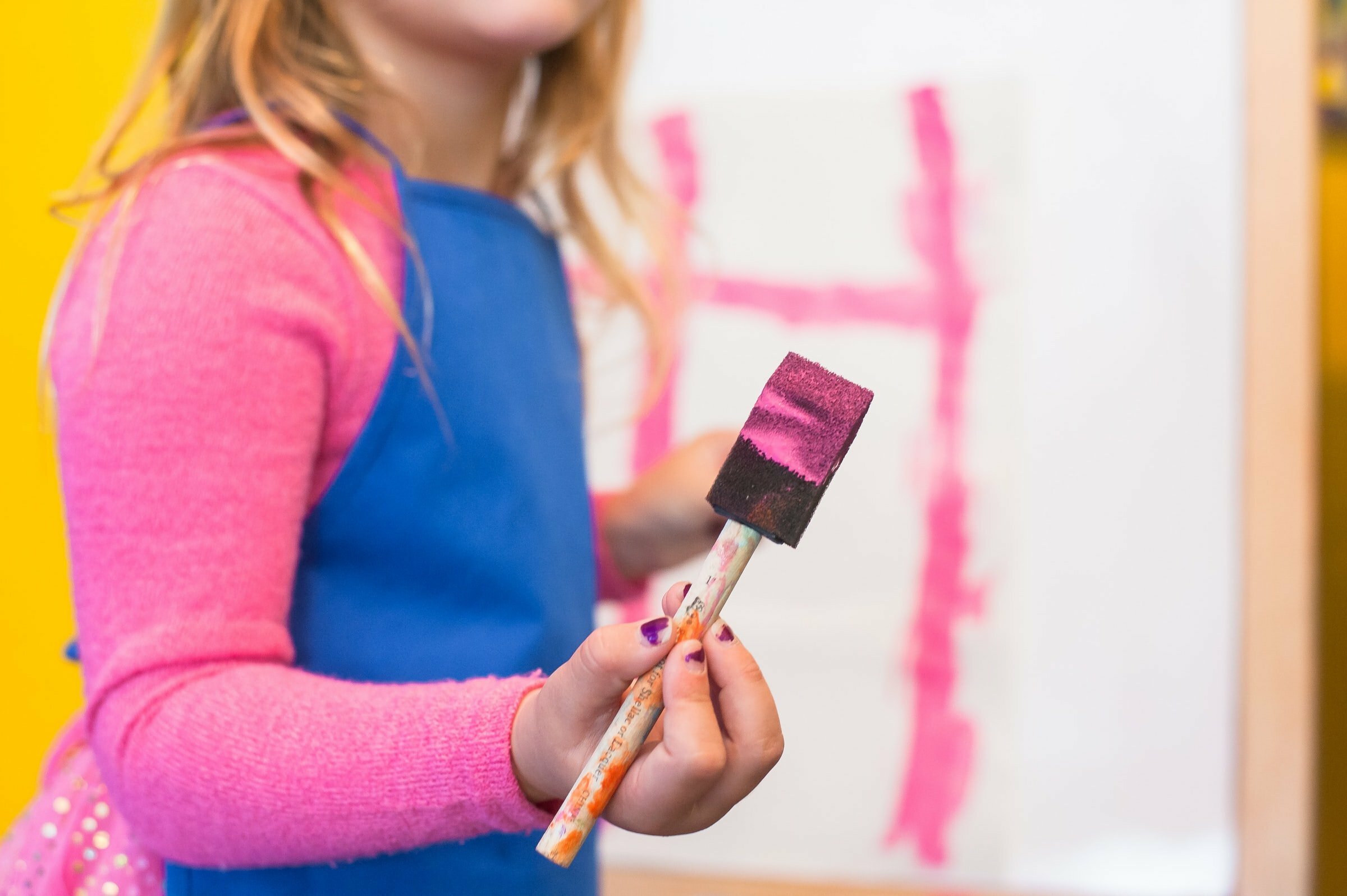 a person painting a red line