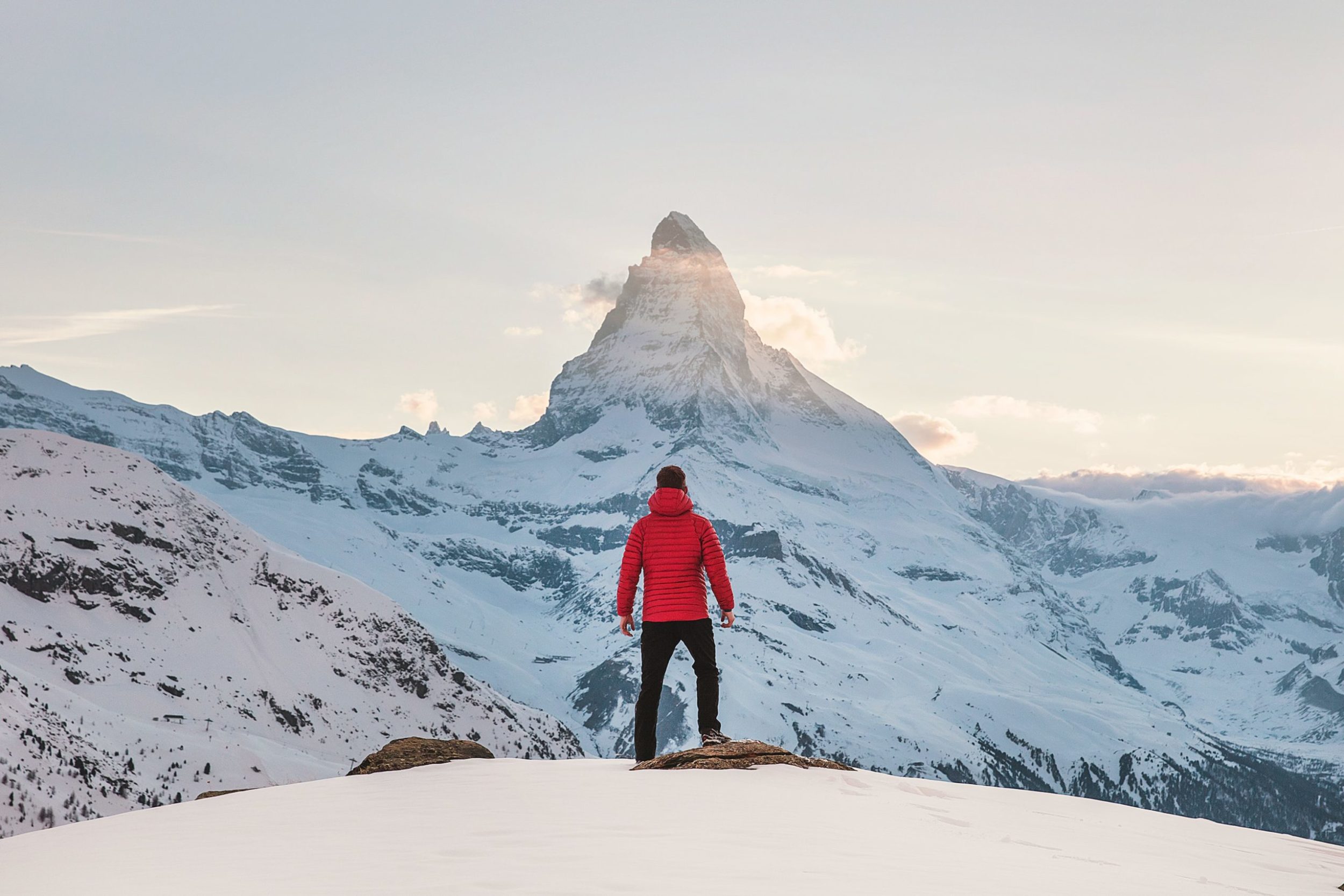 a person standing on a snowy mountain