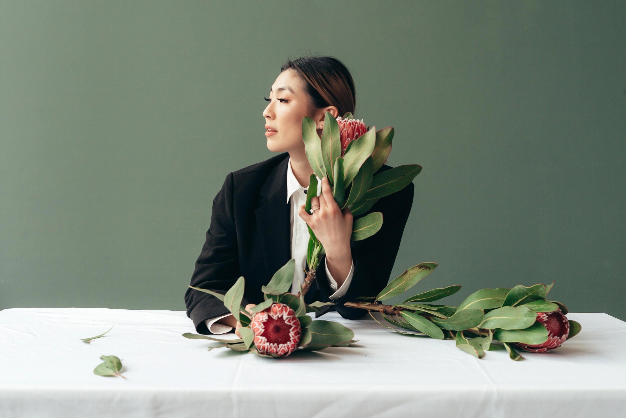 a person holding a bunch of flowers