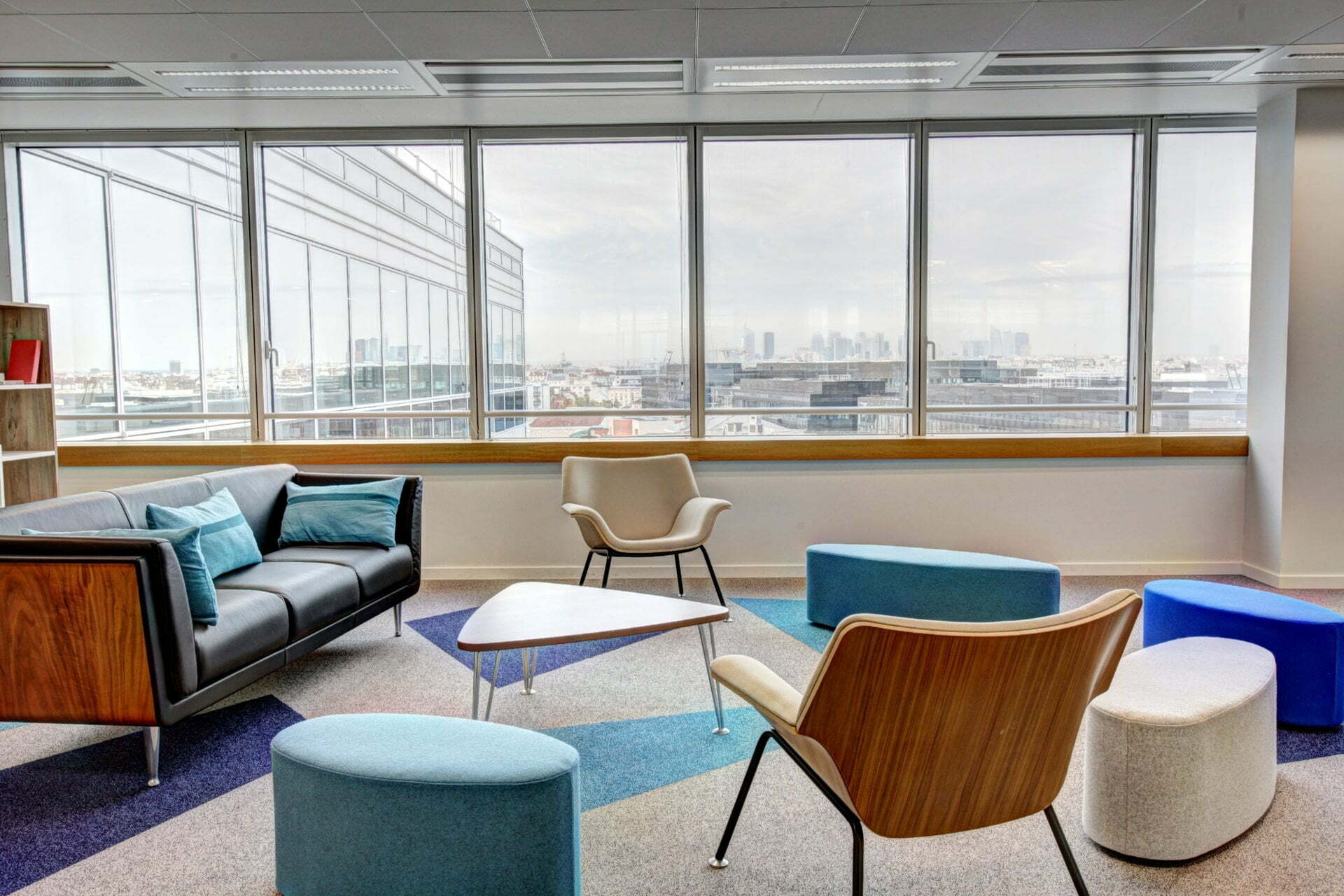 a room with a couch and a table and chairs