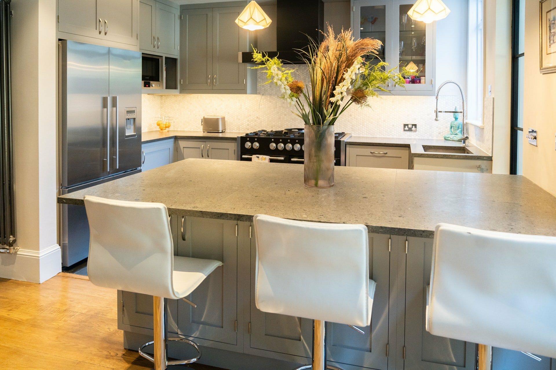 a kitchen with a table and chairs