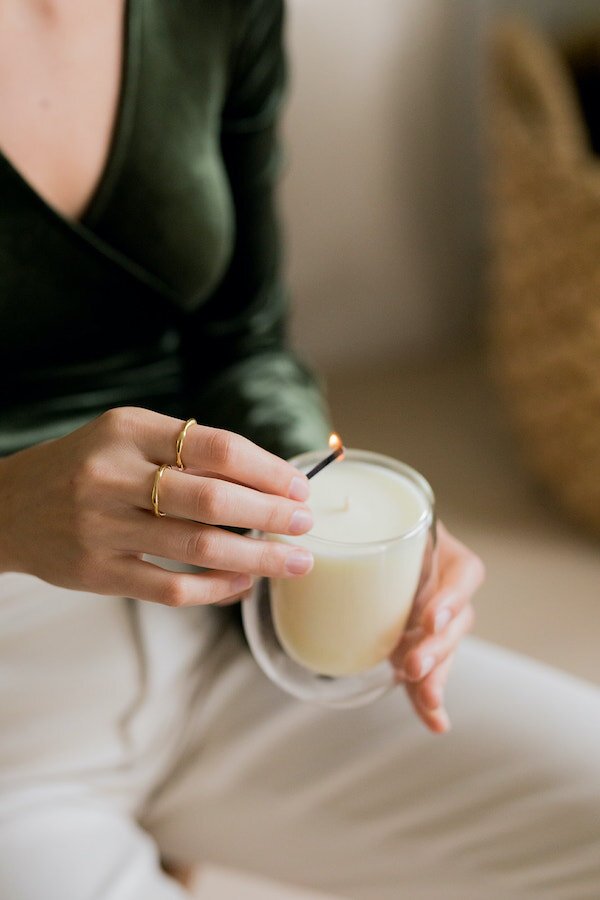 a woman holding a glass of milk