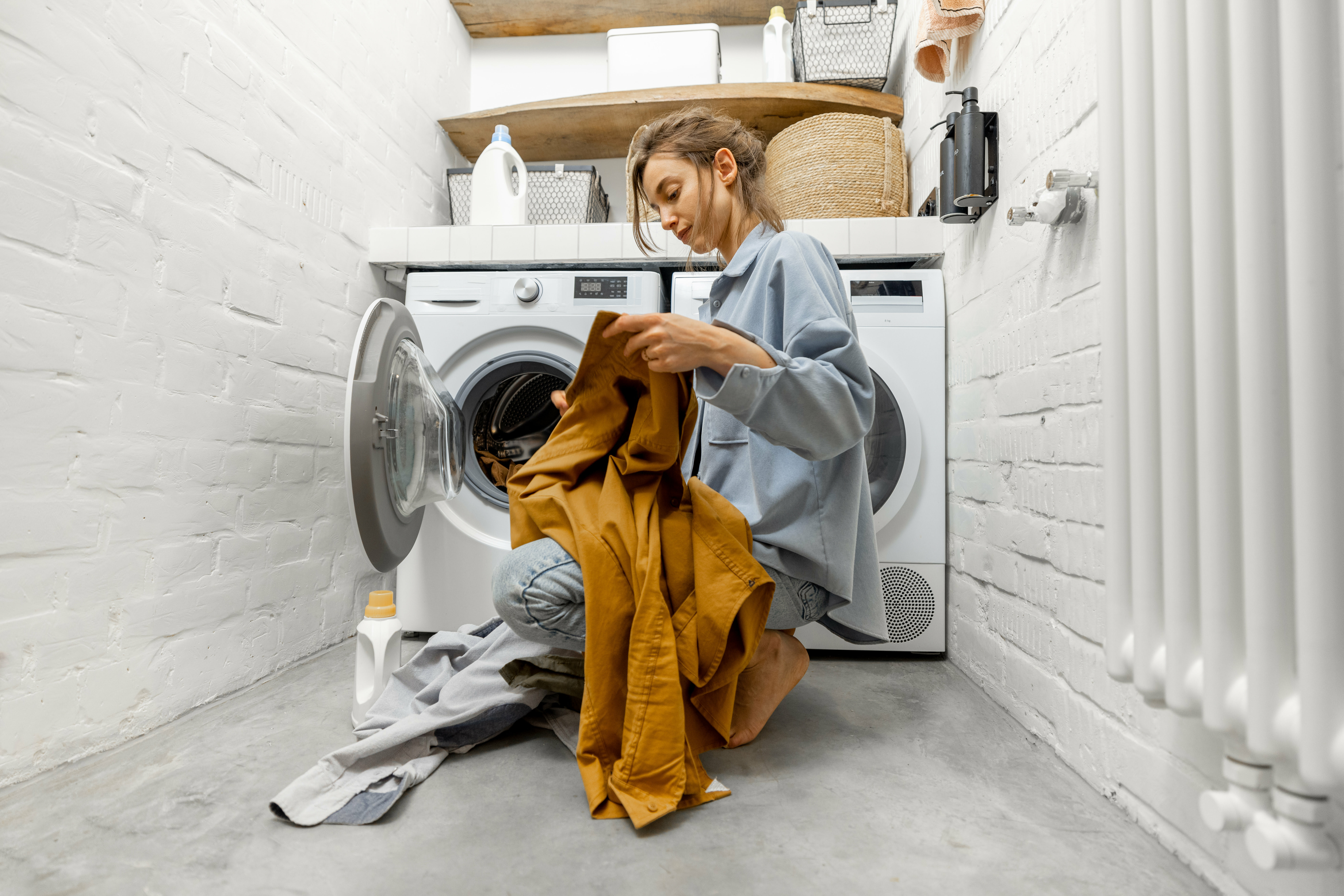 a person in a robe in a laundry room