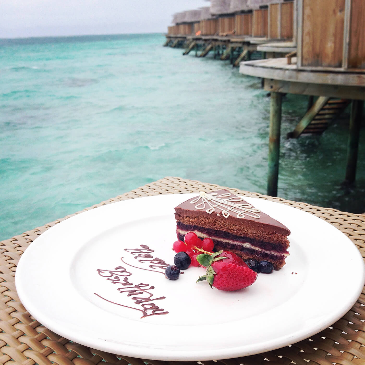 a plate of dessert next to a pool of water