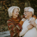 Senior couple embracing in autumn park